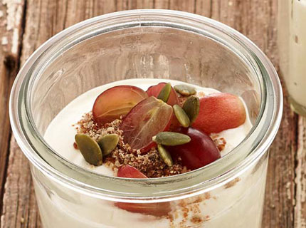 Cup of yoghurt topped with fruit